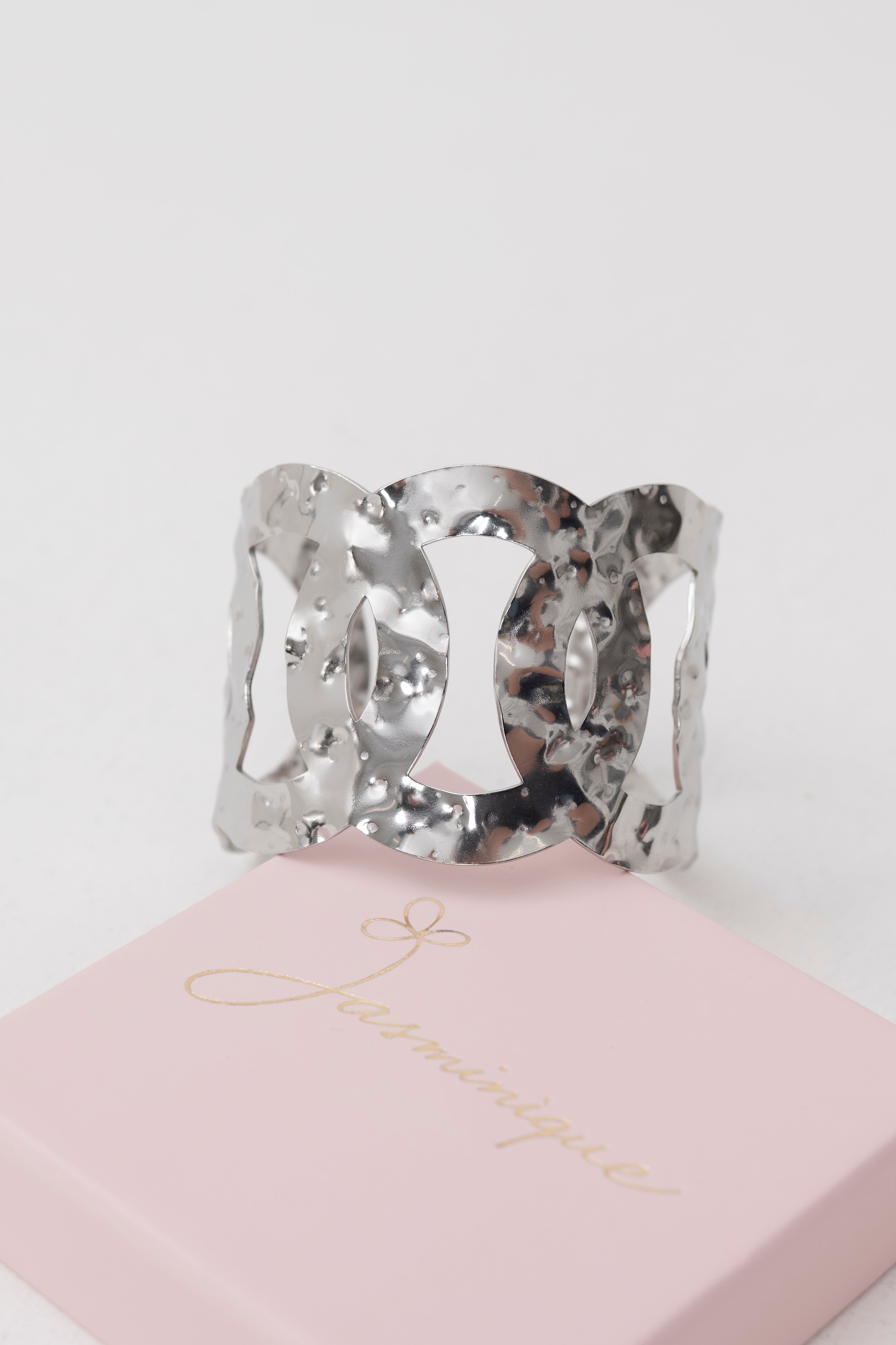 Bracciale rigido regolabile cerchi intrecciati