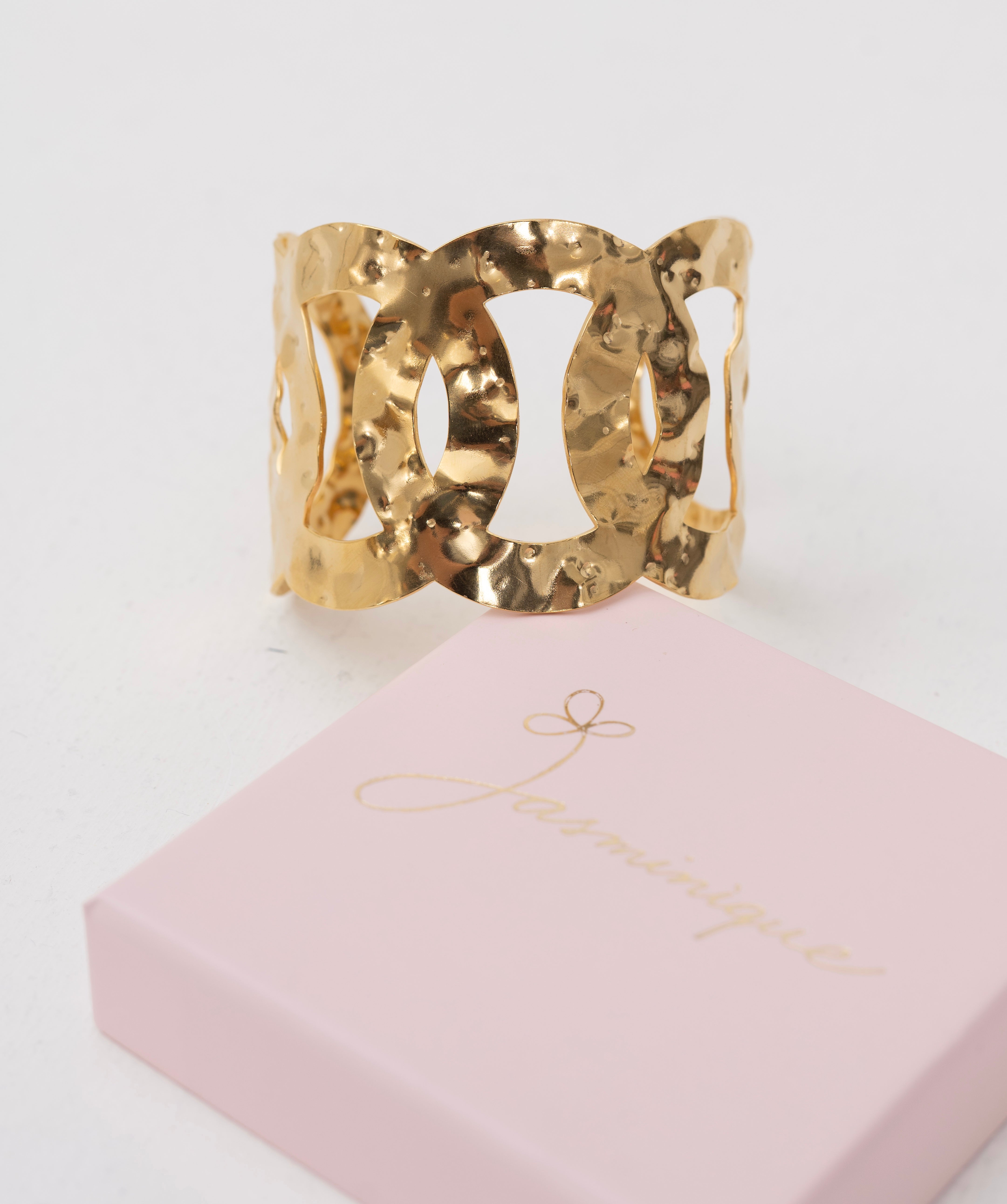 Bracciale rigido regolabile cerchi intrecciati