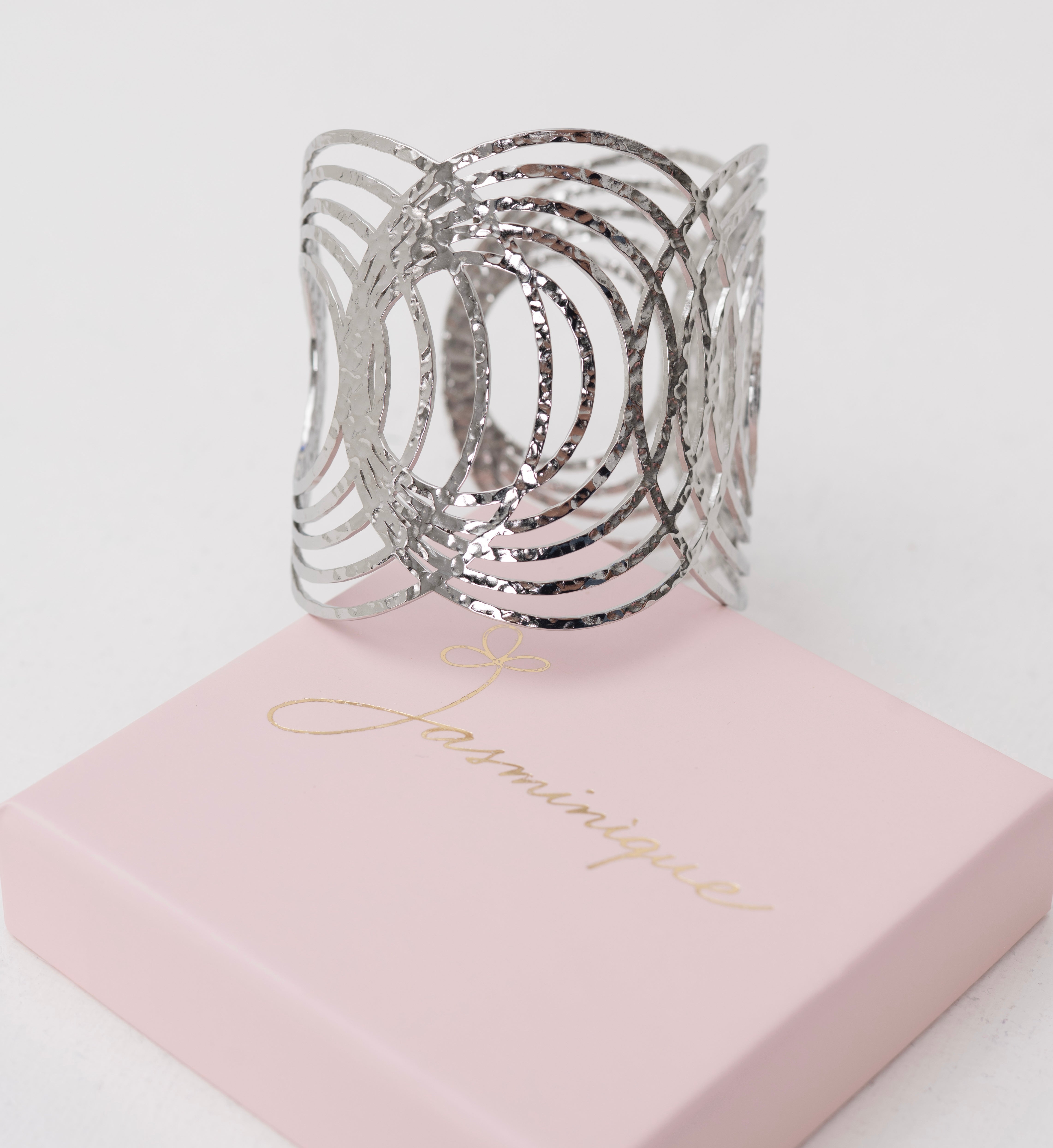 Bracciale rigido cerchi piccoli intrecciati